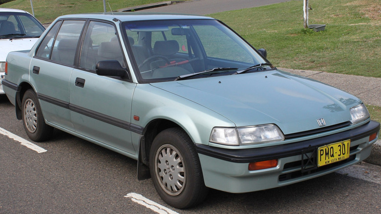 1989 Honda Civic GL parked on roadside with a white car behind