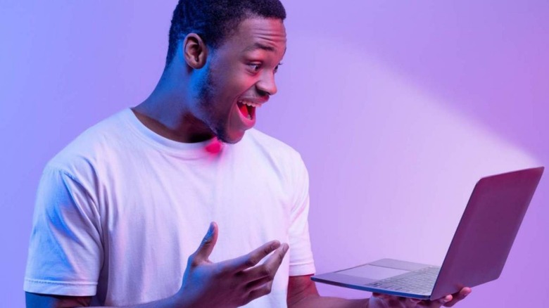 Guy excited by computer