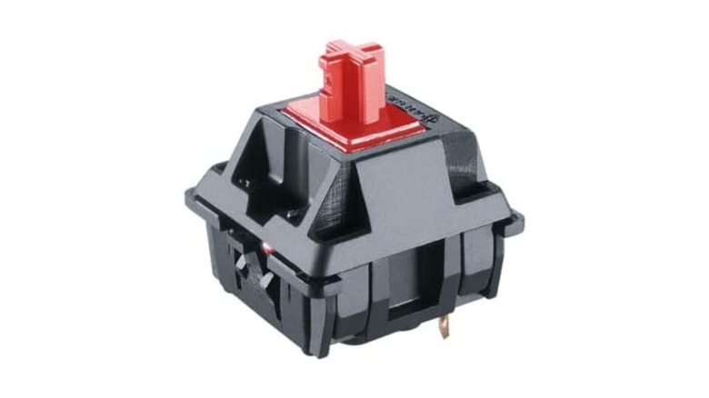 A Cherry MX Red switch against a white background