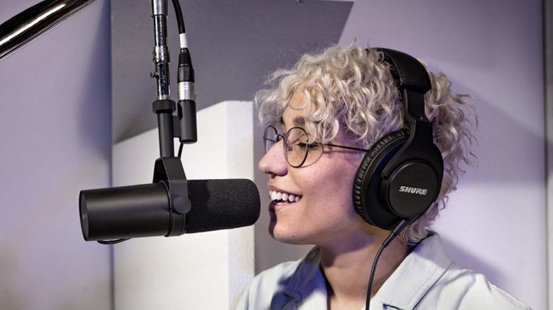 woman recording with shure mic