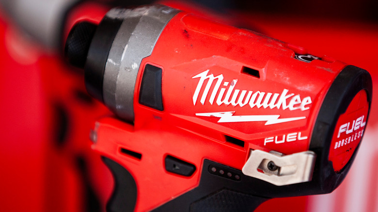 Milwaukee logo on a red power tool