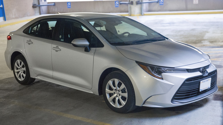 Silver Toyota Corolla LE in a parking garage