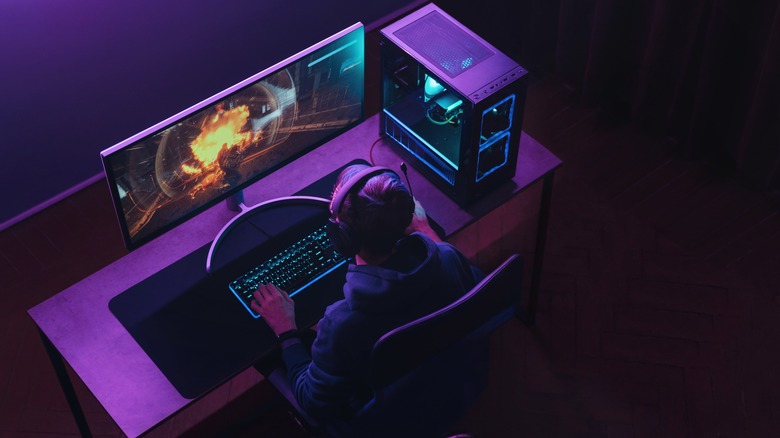 overhear image of young man playing gaming pc