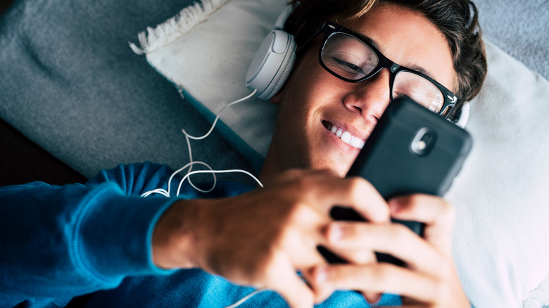 boy listening to phone