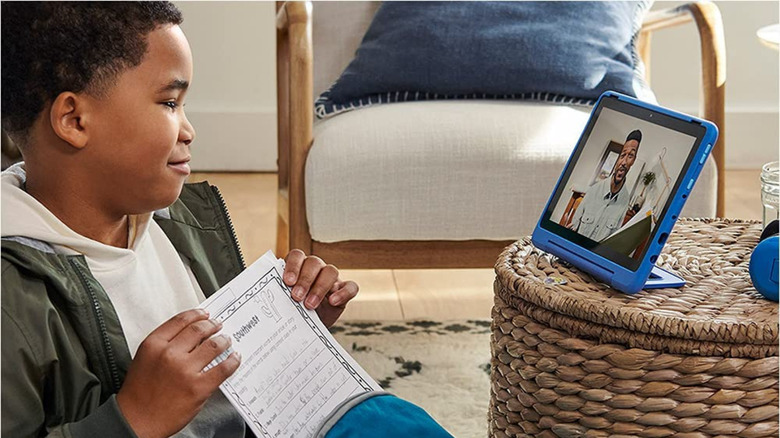 A child video calling their parent on the Amazon Fire 10 Kids Pro.