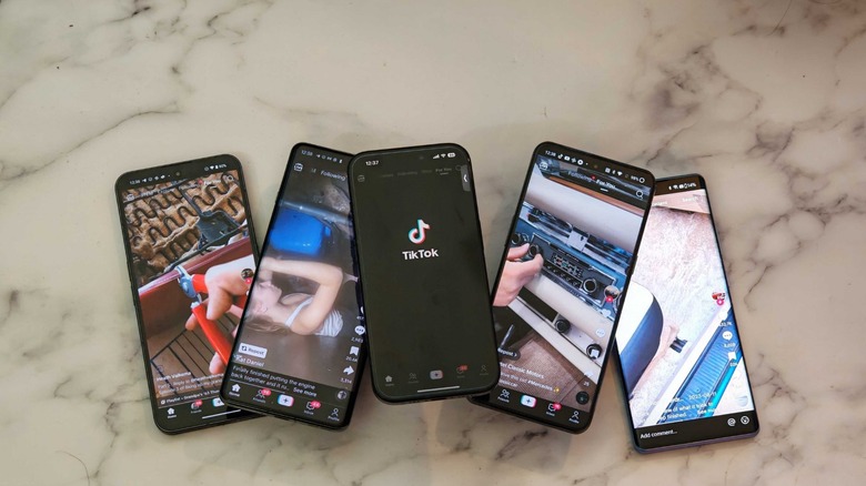 Five smartphones with TikTok onscreen
