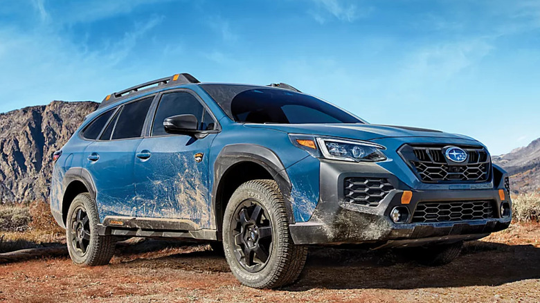 Subaru Outback racing on dirt