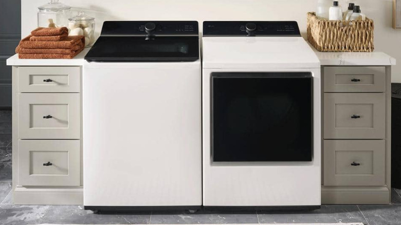 LG's 5.3 cu. ft. mega capacity smart top load washer next to a dryer.
