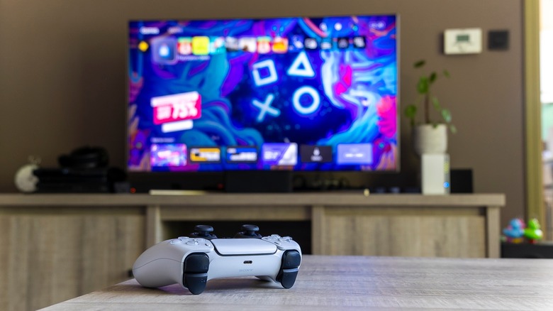 PS5 controller on table in front of TV