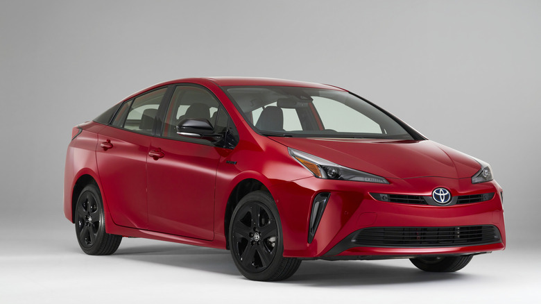 2021 Toyota Prius on white background, front-right 3/4 view