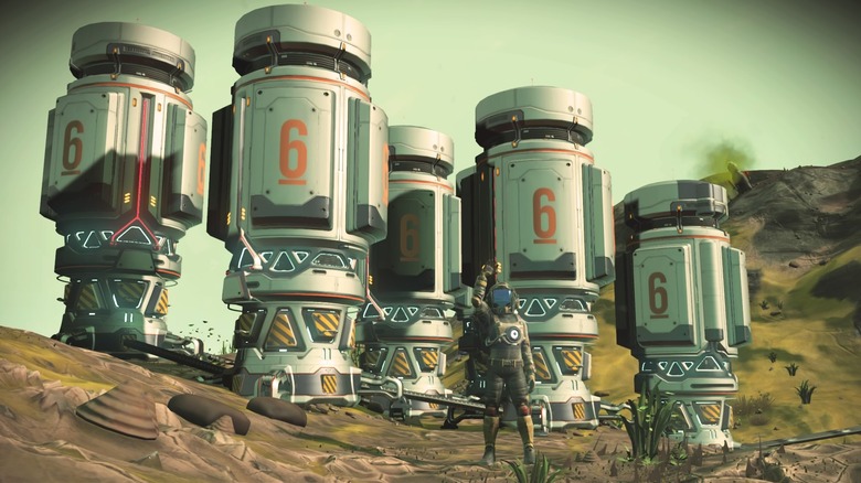 Waving in front of a bank of Supply Depots