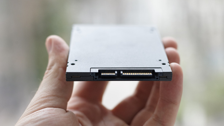Hand holding solid state drive