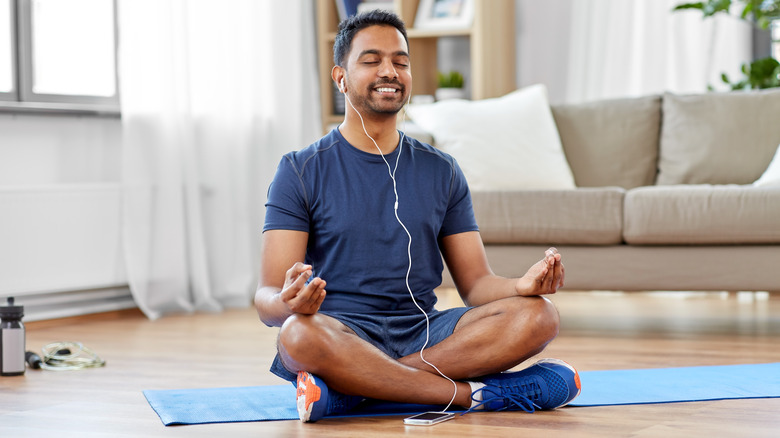 Man using app to meditate