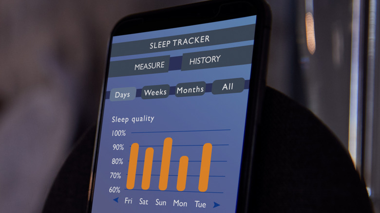 phone sleep tracker with woman sleeping
