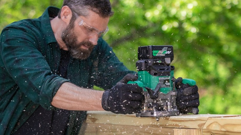 Person using Metabo HPT 36V MultiVolt Cordless Plunge Router