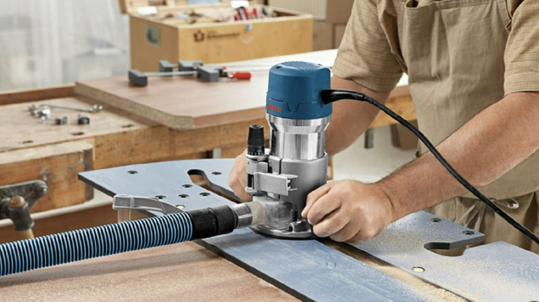 Man using the Bosch Wood Router Tool Combo Kit