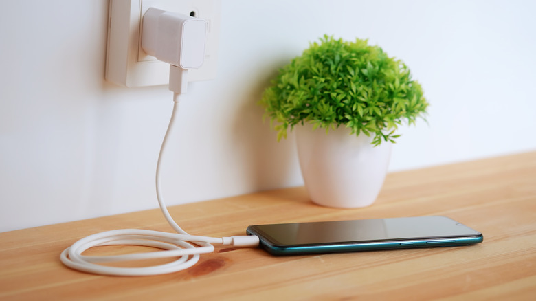 smartphone connected to charger 