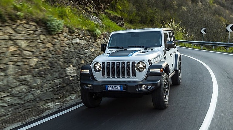 Jeep Wrangler 4xe driving on the road.