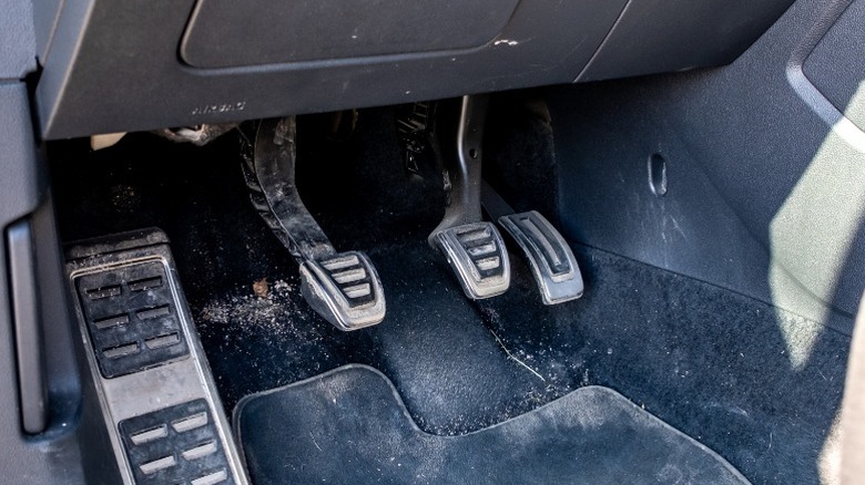 A view of a manual transmission car's three different pedals