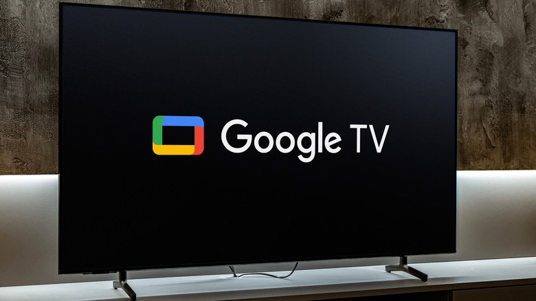 google tv logo on a smart tv placed in a living room