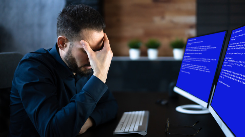 Person frustrated about a computer crashing.