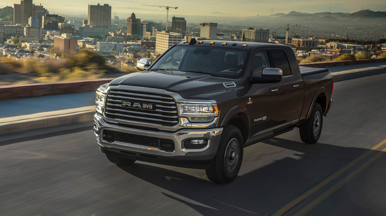 A picture of a 2022 Ram 2500 on a highway near a city