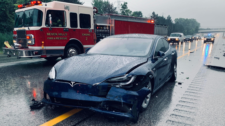 tesla next to fire engine