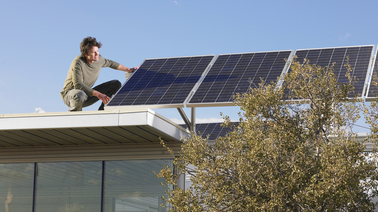 Man installing solar panels