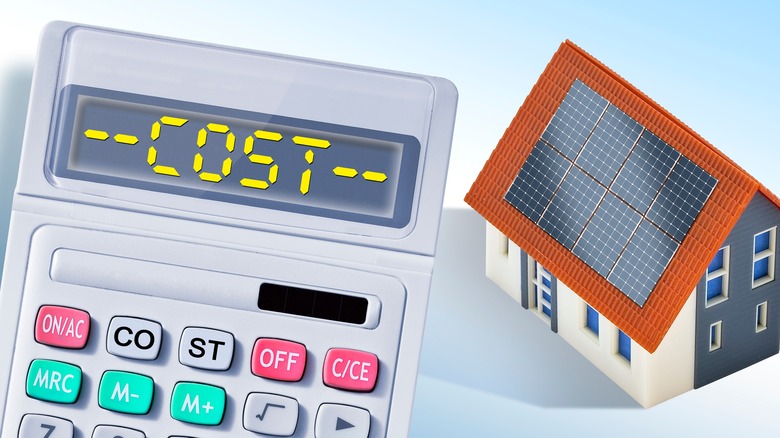 Calculator with house with solar panels