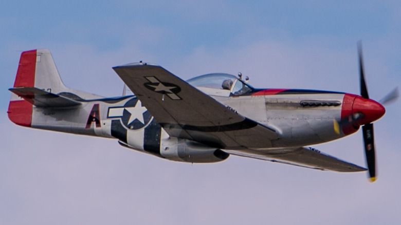 P-51 Mustang flying among clouds