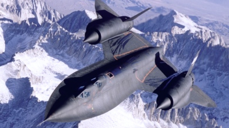 SR-71 Blackbird flying over mountains