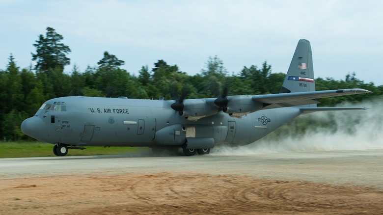 Hercules C-130 on dusty runway
