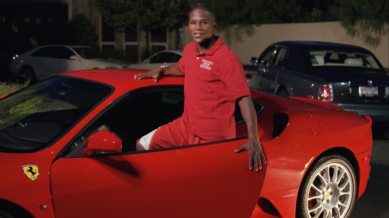 Floyd Mayweather with a Ferrari