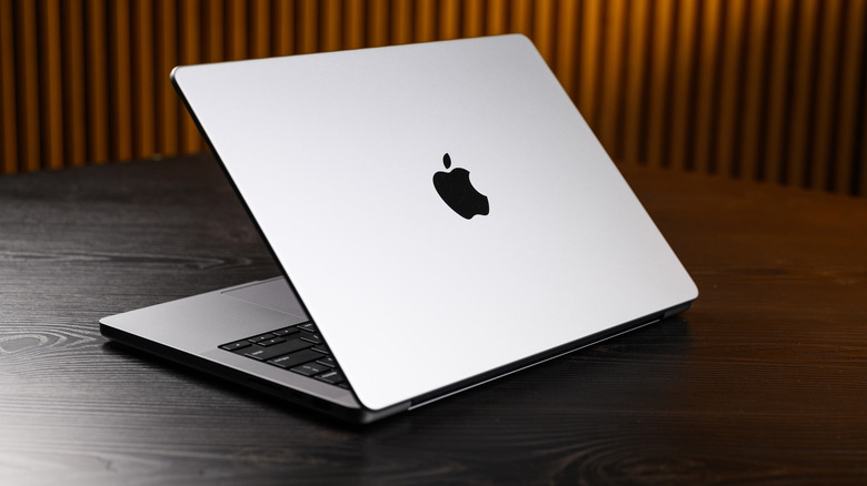 Apple M2 MacBook Pro posed on table