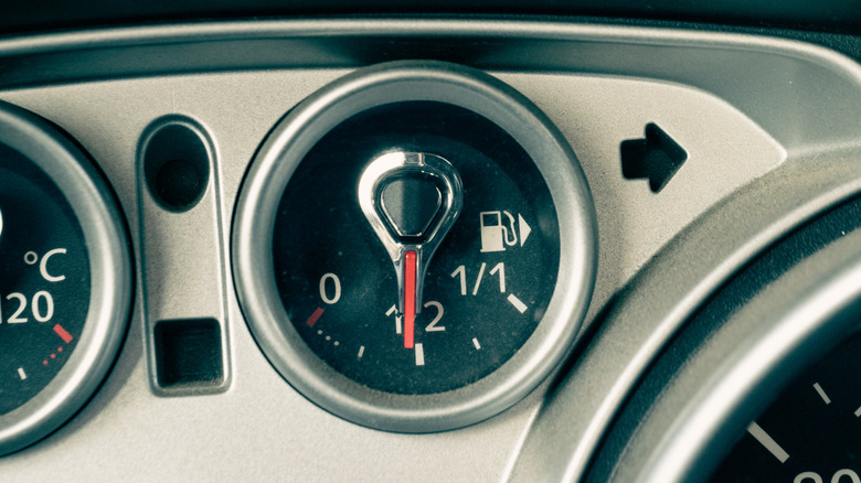 Closeup of a car's fuel gauge on half full