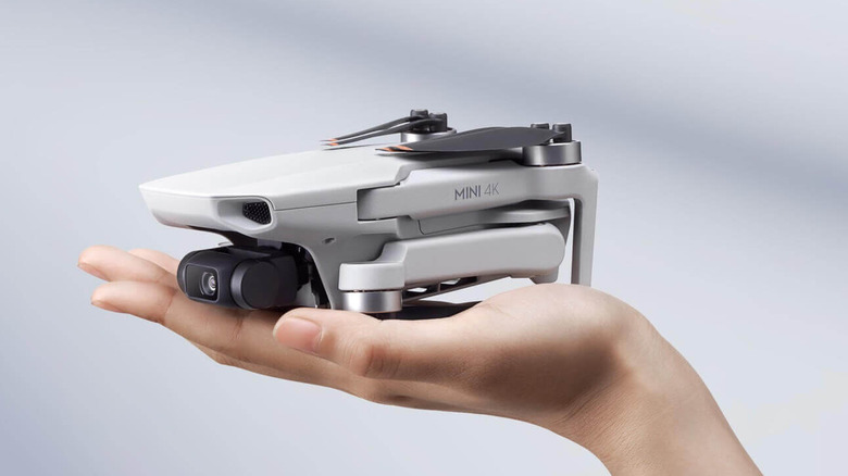 A person holding the DJI Mini 4K