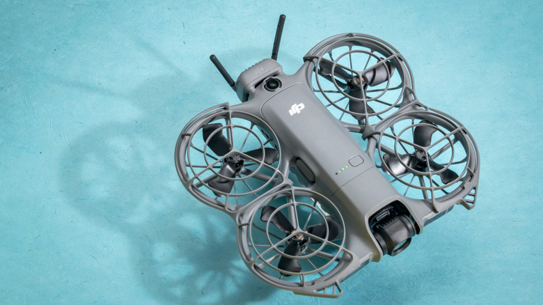 DJI Neo 2 against a teal background