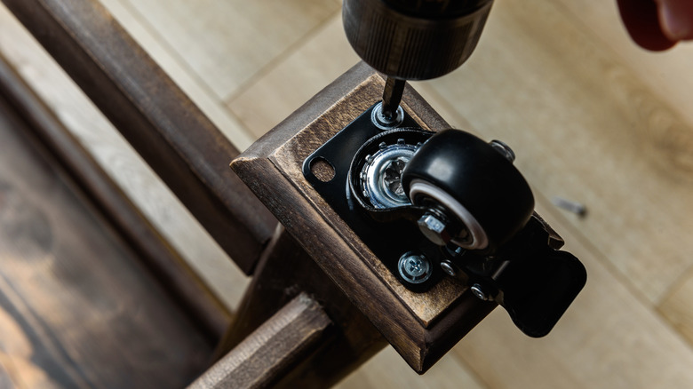 Screwing a caster to a table