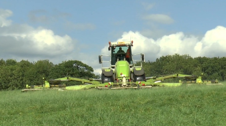 A CLAAS Cougar 1400 mowing a field