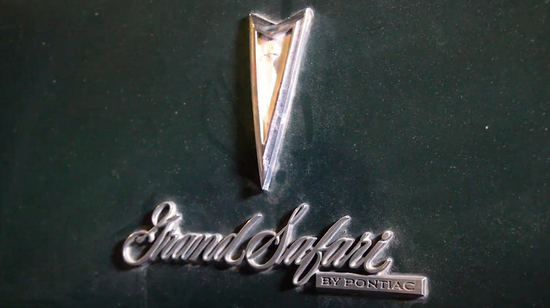 The logo on John Wayne's Pontiac Grand Safari Station Wagon.