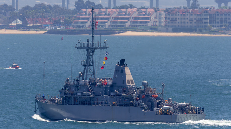 US Navy Avenger class USS Champion cruising close to shore