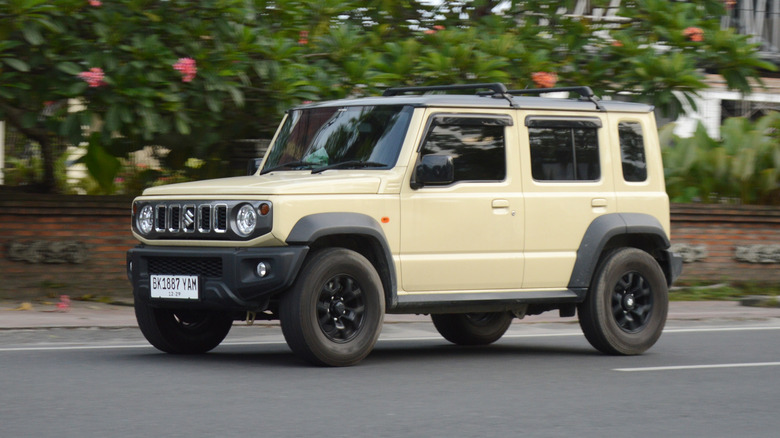 A Suzuki Jimny on the road.