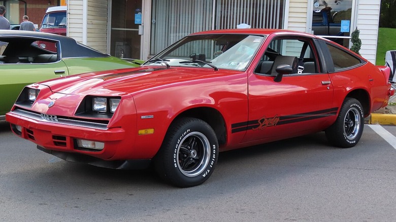 Chevrolet Monza 2+2 V8 in front of a store