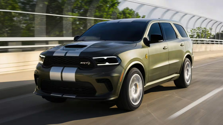 A Dodge Durango in green driving on a freeway
