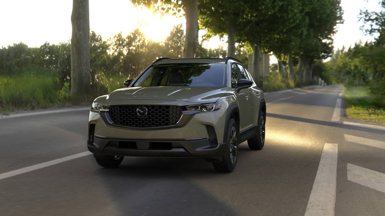 A Zircon Sand Metallic CX-50 on a sunny road