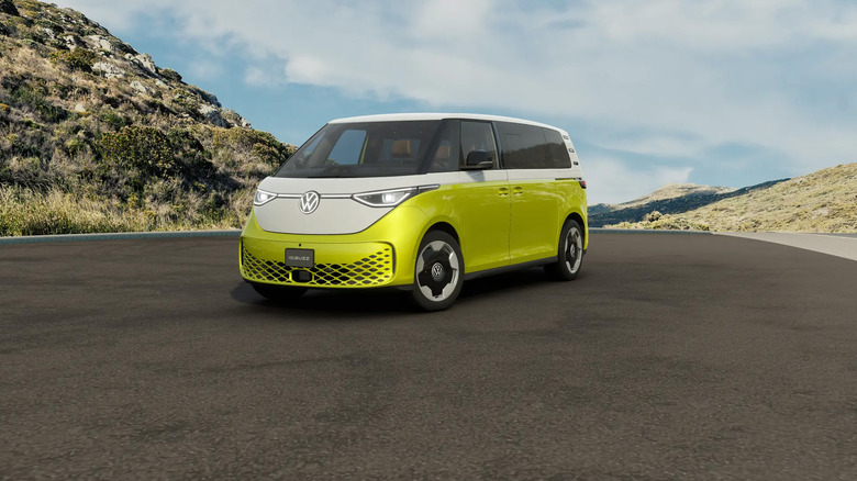 A yellow and white Volkswagen ID.Buzz minivan parked on an asphalt road.