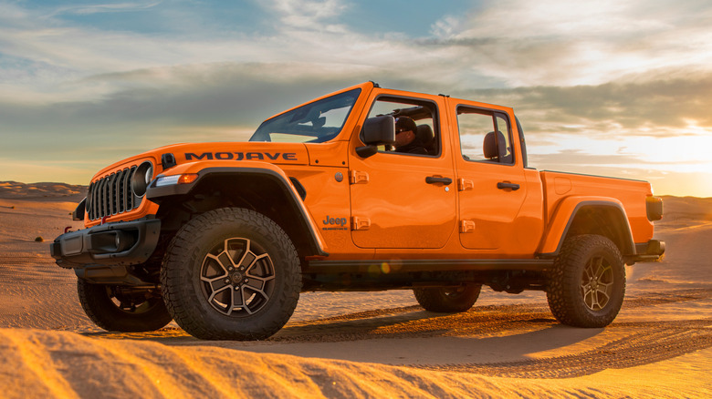 Jeep Gladiator seen from side angle driving in desert