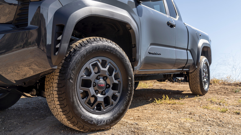 Close-up image of front driver-side tire on Tacoma TRD PreRunner