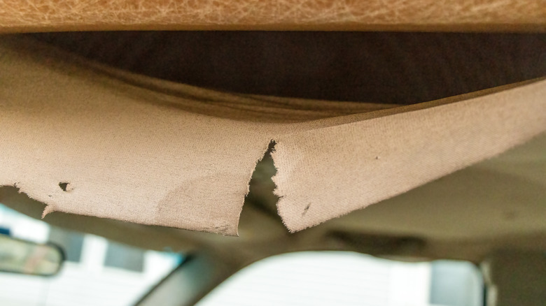 torn and split car headliner