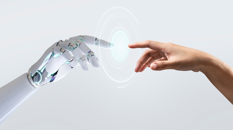 robot touching human finger